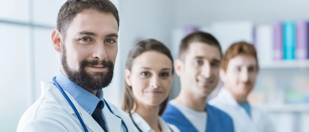 nursing professionals standing together in unison